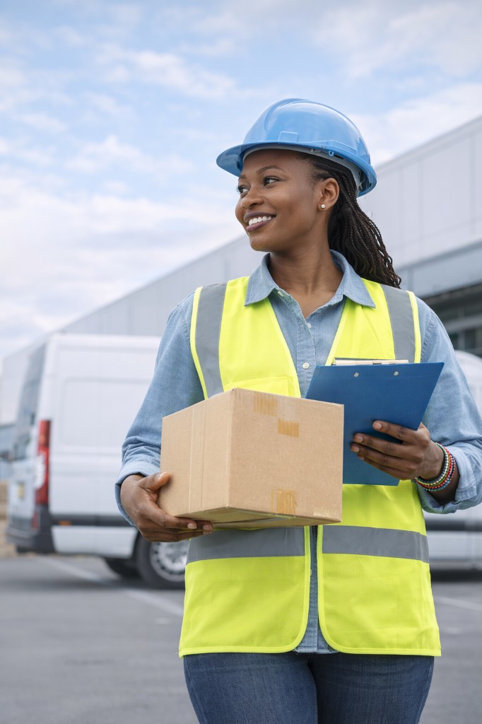 Delivery professional holding carton